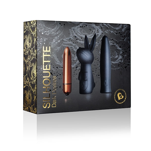 Product packaging for 'Silhouette Dark Desires' with three cylindrical objects on a decorative background.